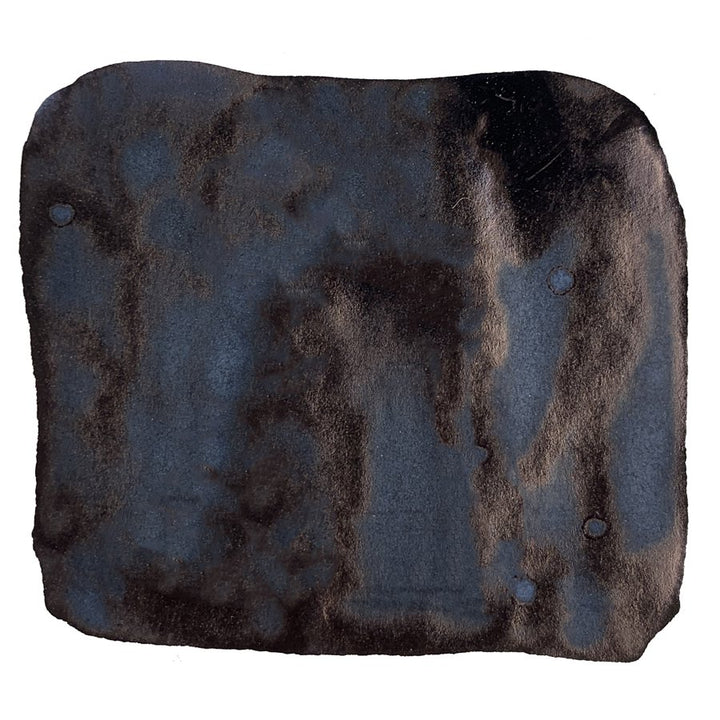 No. 01 Nurebairo - 40ml: Black faux-fur fabric square with four metal snap-studs, resembling a detachable liner or cover.