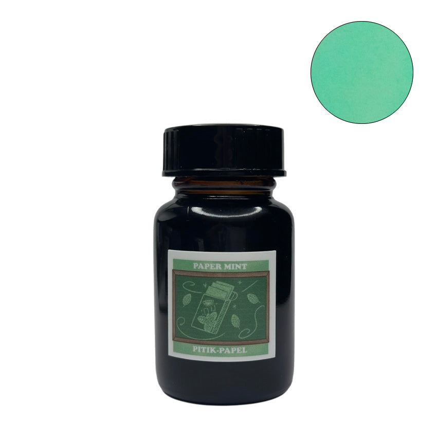 Vinta Inks Paper Mint (Pitik-Papel) 30ml fountain pen ink in an amber glass jar with a black lid, featuring a nostalgic mint green shade.