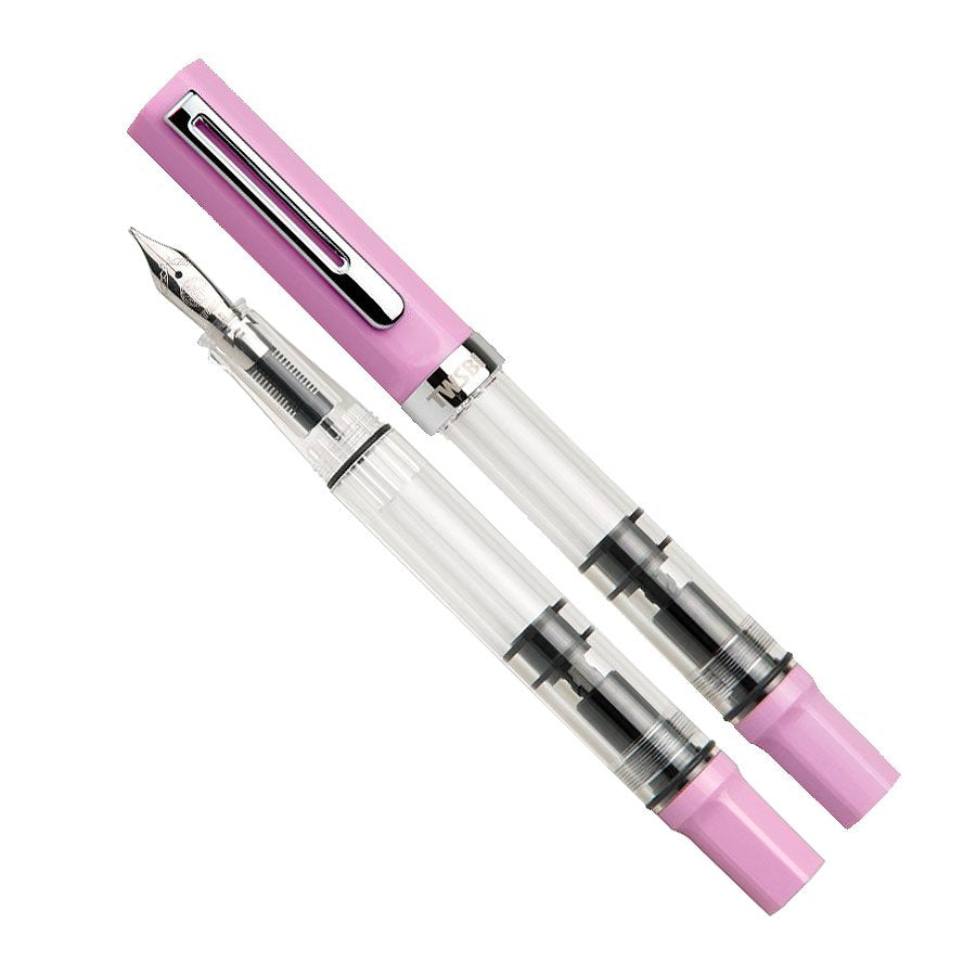 ECO (Pastel Pink) - Extra Fine: Two translucent fountain pens, one capped, one uncapped revealing the silver nib and internal piston mechanism, pink accents, limited edition.