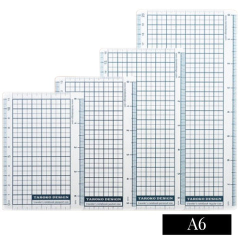 Pencil Board - A6: Four clear, ruled-grid overlays with 5 mm grids, centimeter scales, and an A6 label, serving as book markers and rulers.