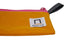 Pencil Pouch - Saffron: A mustard-yellow canvas pouch with a pink zipper, black loop, and Nock Co. logo tag, designed for pens and accessories.