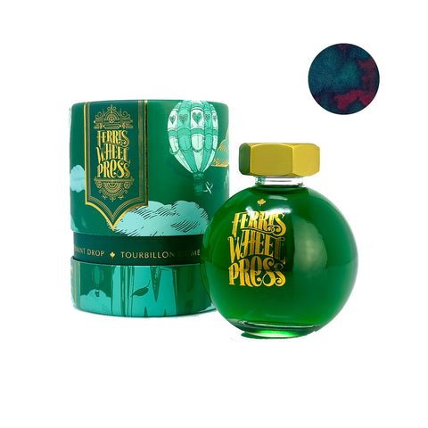 Peppermint Drop - 85ml: A round glass bottle of bright green Ferris Wheel Press ink with gold cap, in a green gift box with hot-air-balloon design.