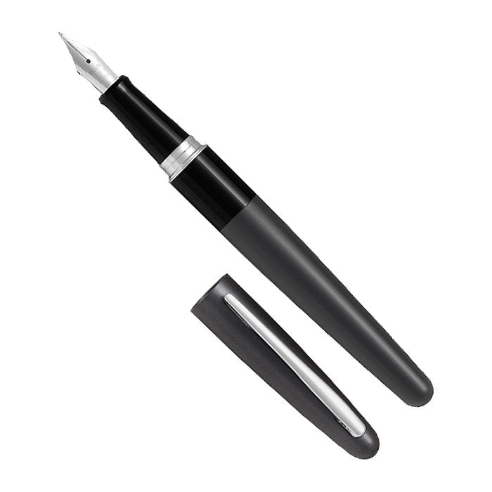 MR1 (Black)- Fine fountain pen with matte-black barrel, exposed steel nib, and silver trim; cap with silver clip lies beside. Includes black ink cartridge and converter.