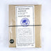 Passport Leather Cover (Black) by Traveler’s Company, Japan, sealed in a brown kraft sleeve with a white label, secured by a black elastic band.