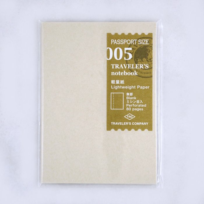 #005 Blank Refill (Passport) by Traveler's Company, sealed in plastic, features 80 perforated, lightweight pages, ideal for Traveler's Notebook, fountain pen friendly.
