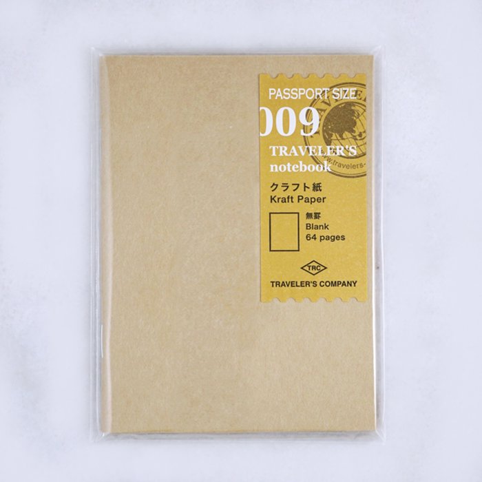 Traveler’s Notebook refill #009, passport size, sealed in plastic. Kraft-paper insert with 64 blank pages, ideal for fountain pen writing.