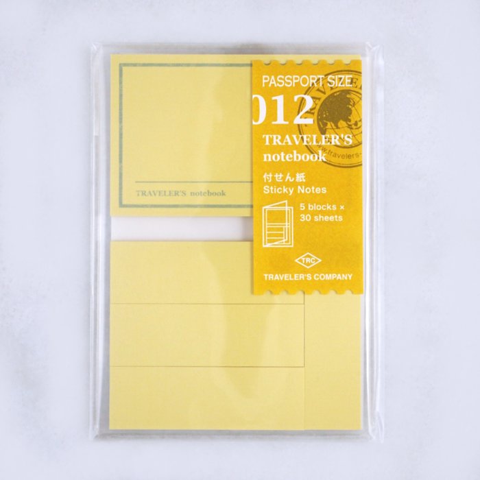 #012 Traveler’s Notebook Sticky Notes, sealed pack, passport-size, with 150 sheets across five pads by Traveler’s Company, designed for easy note-taking.