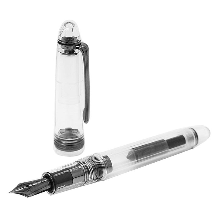 Nagasawa Original Profit Skeleton Proske - Broad fountain pen, transparent body revealing ink reservoir, rhodium-plated 14K gold nib, cap set aside, showcasing elegant design.