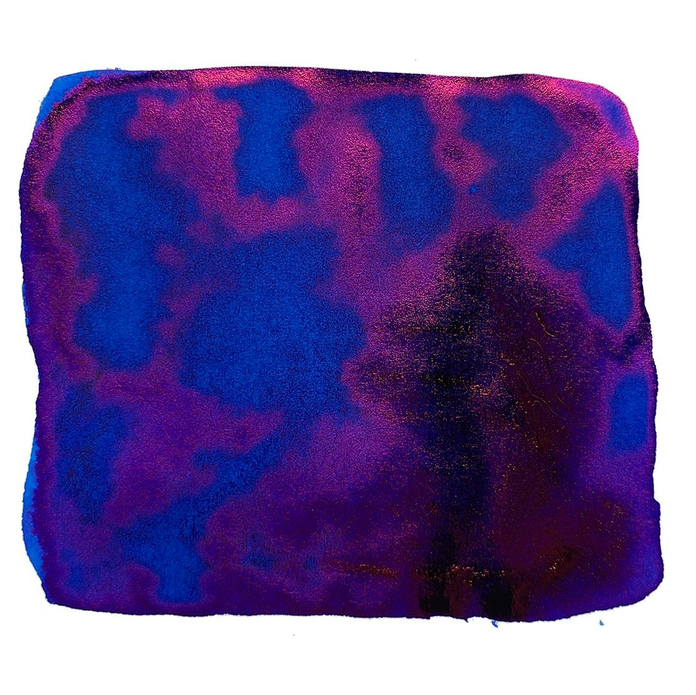 Prussian Blue - 18ml swatch displays a rich indigo to magenta hue with a subtle golden sheen, capturing the dye-based ink's vibrant sheen properties.