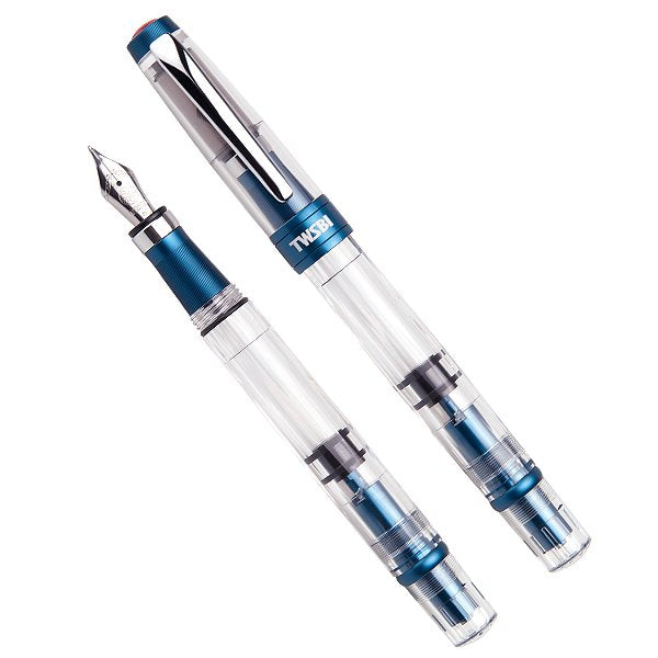 Diamond 580 ALR (Prussian Blue) - Stub 1.1 fountain pen with transparent barrel and cap, blue metal trim, steel nib, and piston-filling mechanism.