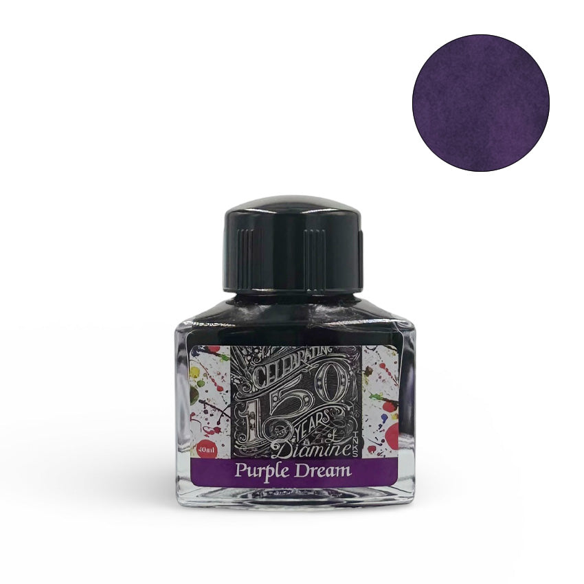 Diamine Purple Dream (150th Anniversary) fountain pen ink, 40ml glass bottle with triangular design, featuring a black screw-on cap and purple swatch.