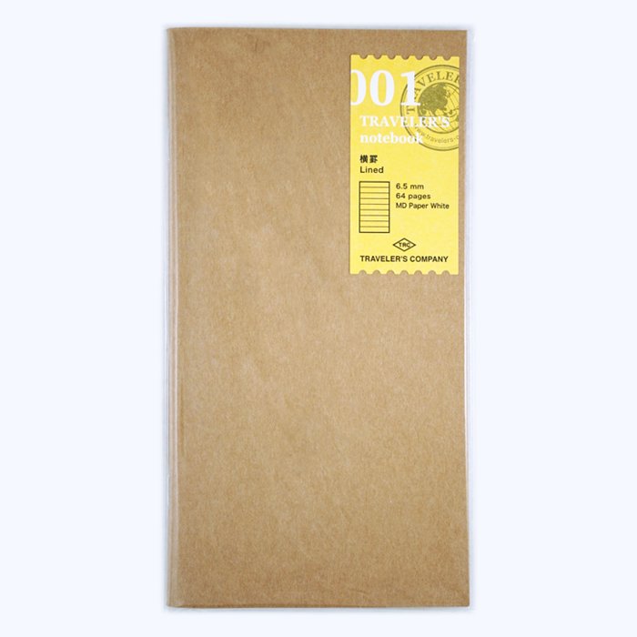 #001 Lined Refill (Regular) in kraft-paper sleeve with yellow label, featuring 64 pages of fountain pen-friendly MD Paper White, compatible with Traveler's Notebook system.