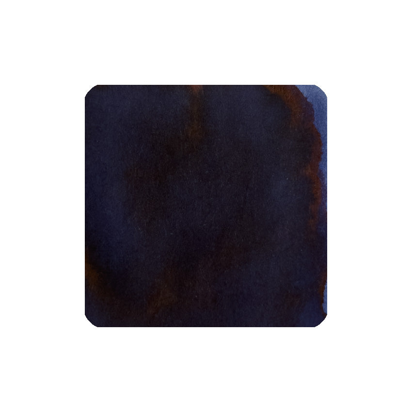 Regency Blue (150th Anniversary) fountain pen ink in a unique 40ml triangular bottle, showcasing a deep, inky blue-black watercolor swatch with brownish-rust hints.