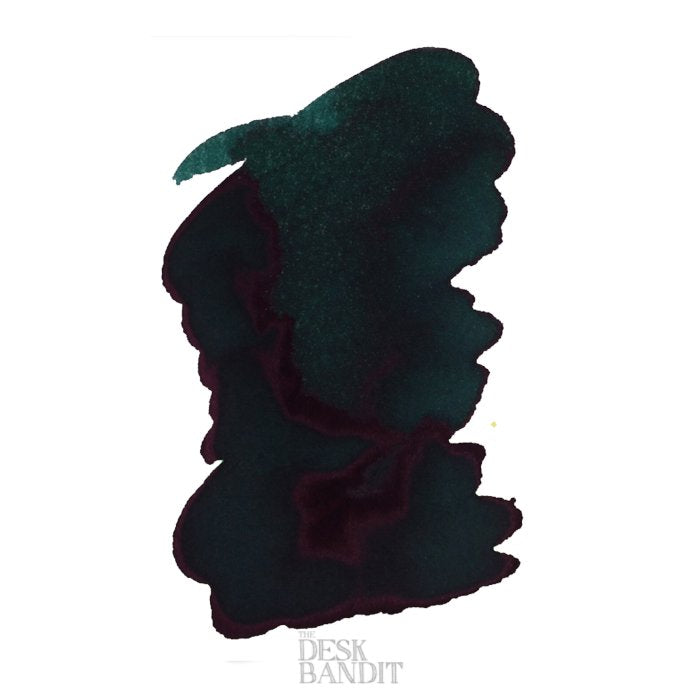 River of Fire - 2ml ink sample features a dark teal-green with reddish-purple sheen and gold shimmer, displayed on white paper with The Desk Bandit watermark.