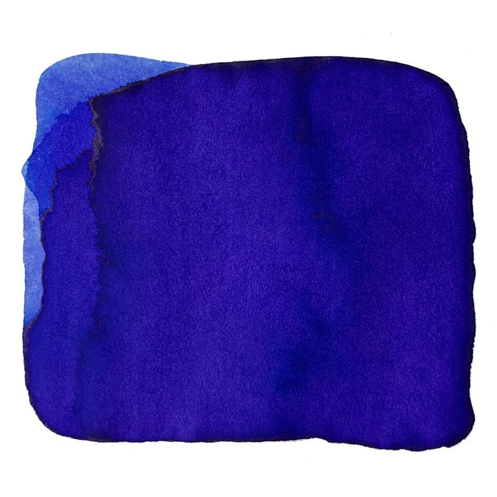 Ink Studio #443 - 20ml features an ultramarine-blue watercolor swatch on white paper, showcasing subtle tonal variations and soft, lighter edges.