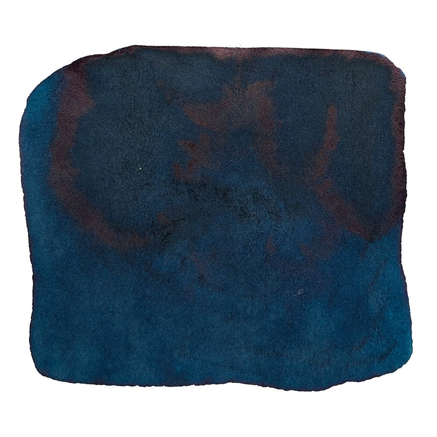 Ink Studio #641 - 20ml: A dark-blue, plush textured fabric piece, resembling a small bath mat or rug, showcasing Sailor's curated ink collection.