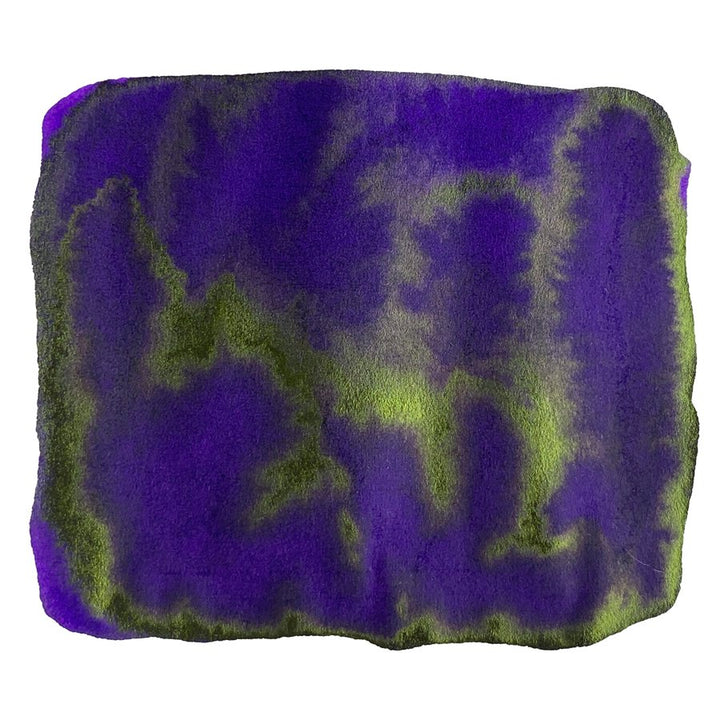 Ink Studio #750-2ml swatch shows deep violet-purple with yellowish-green veins, creating a marbled effect on textured paper, highlighting Sailor's curated ink collection.