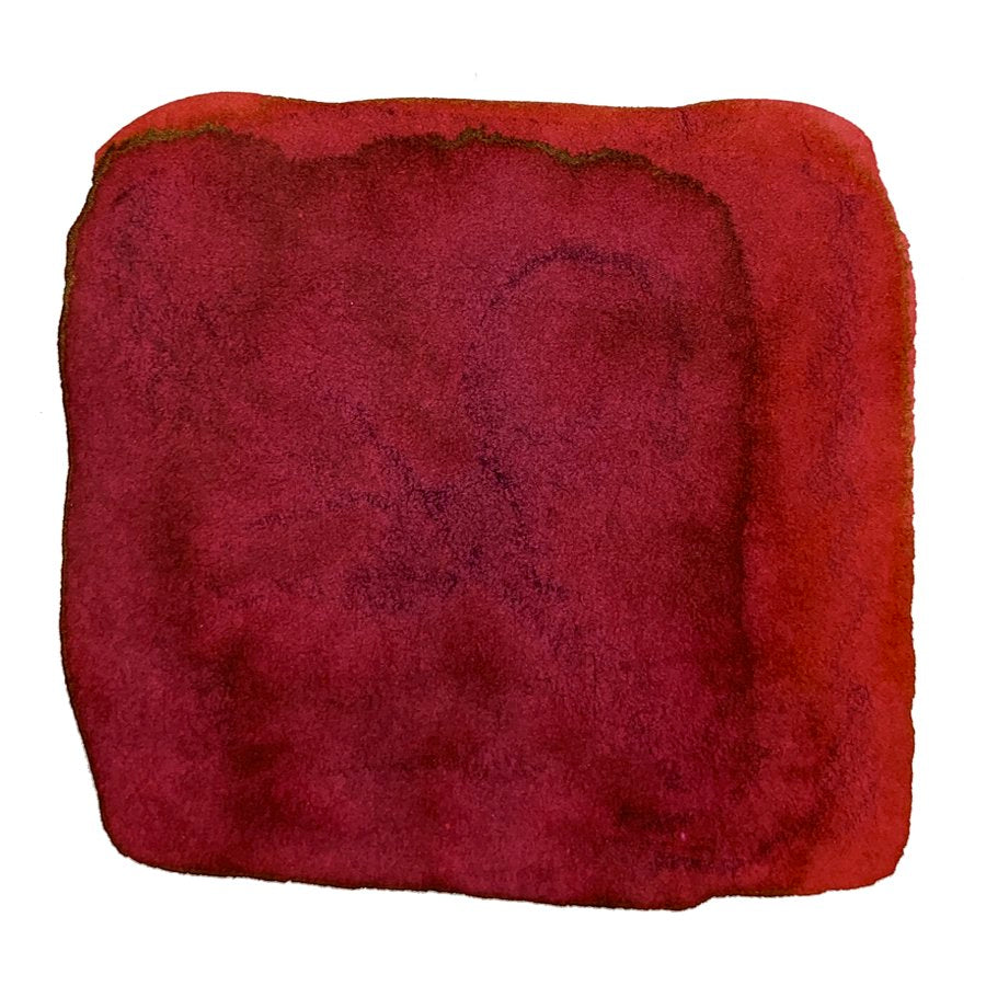 Ink Studio #830 - 20ml features a red watercolor swatch with subtle tonal variations and darker pigment pooling along the soft, uneven edges.