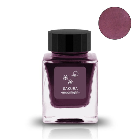 Square glass bottle of Sakura Moonlight fountain pen ink, 30ml, by Tono & Lims, featuring a dusky pinkish-purple shade with a black screw-on cap.