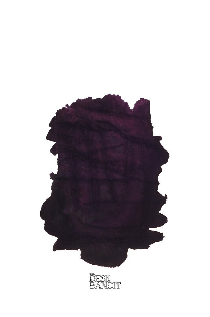 Scabiosa (Iron Gall) - 2ml ink swatch, a dark purple-black blot, labeled “THE DESK BANDIT,” showcasing Rohrer & Klingner’s handcrafted fountain-pen ink from Leipzig.