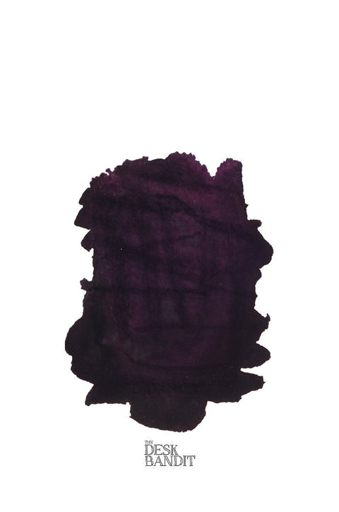 Scabiosa (Iron Gall) - 2ml ink swatch, a dark purple-black blot, labeled “THE DESK BANDIT,” showcasing Rohrer & Klingner’s handcrafted fountain-pen ink from Leipzig.