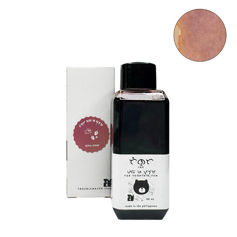 60 ml bottle and box of Sepia Hour fountain-pen ink by Troublemaker Inkery, featuring a cat icon and circular swatch of the sepia color.