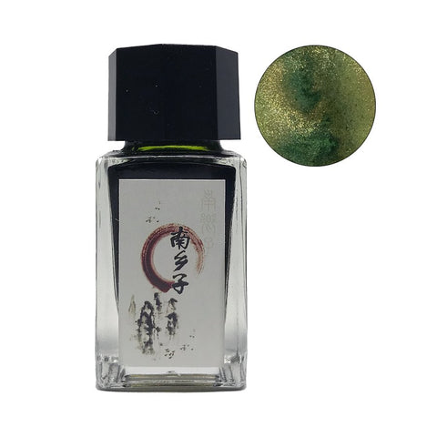 Southern Village - 18ml fountain-pen ink in a square glass bottle with black cap, featuring Japanese brush-stroke label and green ink with gold shimmer swatch.