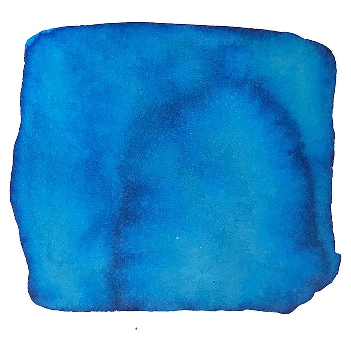 Abstract blue blot resembling a watercolor sample, showcasing Colorverse's Strelka - 2ml ink from the Trailblazer In Space Collection, known for its plant-based, quality formulation.