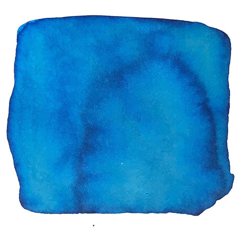 Abstract blue blot resembling a watercolor sample, showcasing Colorverse's Strelka - 2ml ink from the Trailblazer In Space Collection, known for its plant-based, quality formulation.