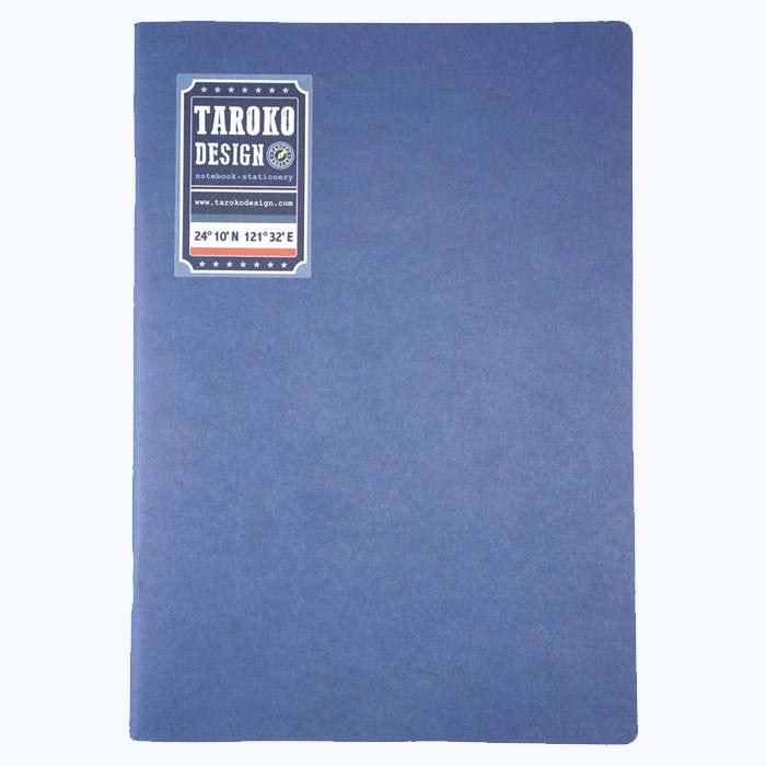 Tomoe River Insert - A5 Blank by Taroko Design, a blue soft-cover notebook, features 64 lightweight pages with a label displaying brand and coordinates.