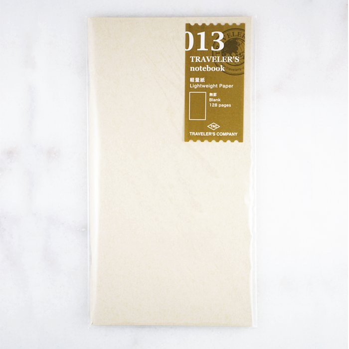 #013 Lightweight Refill sealed pack containing a slim, 128-page blank insert made with thin, fountain pen friendly Tomoe River Paper for Traveler’s Notebook.