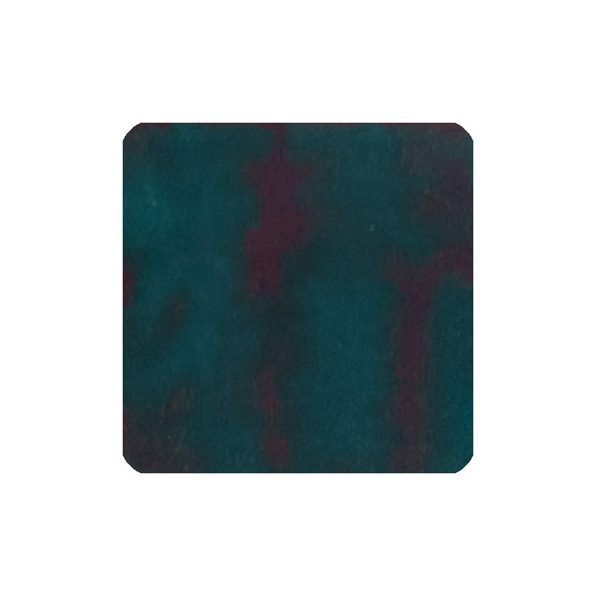 Teal - 30ml Bottled Ink by Diamine, showcasing a textured dark teal-green with maroonish-red patches, ideal for smooth, dependable fountain pen use.