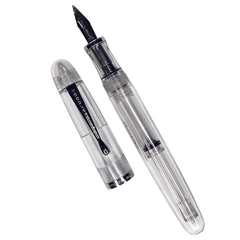 Triple Tail Flex Pen by Noodler's Ink, featuring a transparent body with visible ink reservoir and a three-tine flex nib, cap placed beside the barrel.