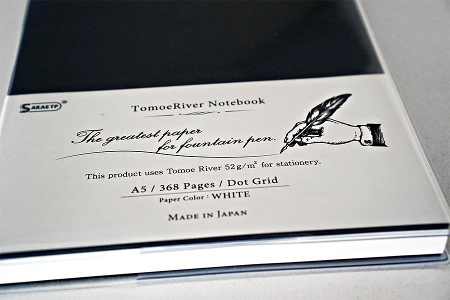 Tomoe River Notebook A5 - Dot Grid packaging, showcasing 368 white pages, fountain pen-friendly 52gsm paper, and embossed logo, highlighting Japan-made quality.