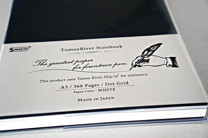 Tomoe River Notebook A5 - Dot Grid packaging, showcasing 368 white pages, fountain pen-friendly 52gsm paper, and embossed logo, highlighting Japan-made quality.