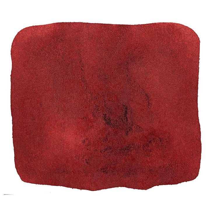 Tsvetayeva - 88ml ink by Noodler's Ink; deep red, irregularly-shaped square with a textured, mottled appearance, resembling watercolor.