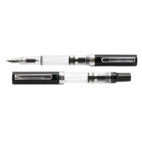 TWSBI ECO (Black) - Fine fountain pens, one capped, one with cap posted. Clear resin shows metal nib and piston-filling mechanism.