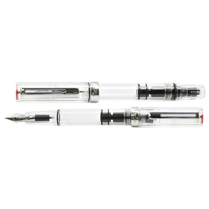 TWSBI ECO (Clear) - Stub 1.1 fountain pens, one capped and one uncapped, showcasing transparent body with visible piston-filling mechanism and ink chamber.