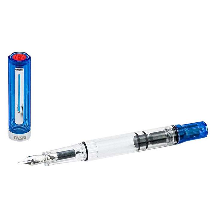 TWSBI ECO (Transparent Blue) - Broad fountain pen with clear barrel, translucent blue cap and tail, featuring a piston-fill mechanism for visible ink movement.