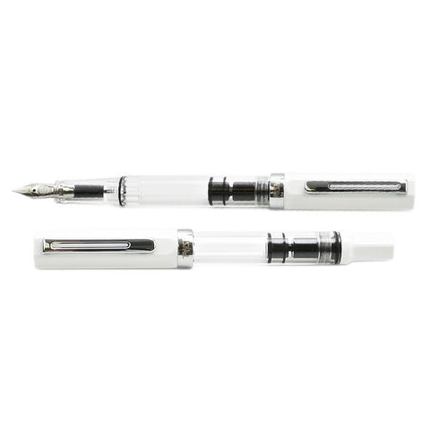 ECO (White) - Medium fountain pen features a clear barrel, visible piston-fill system, white cap, silver trim, and medium nib. Ideal for ink level monitoring.