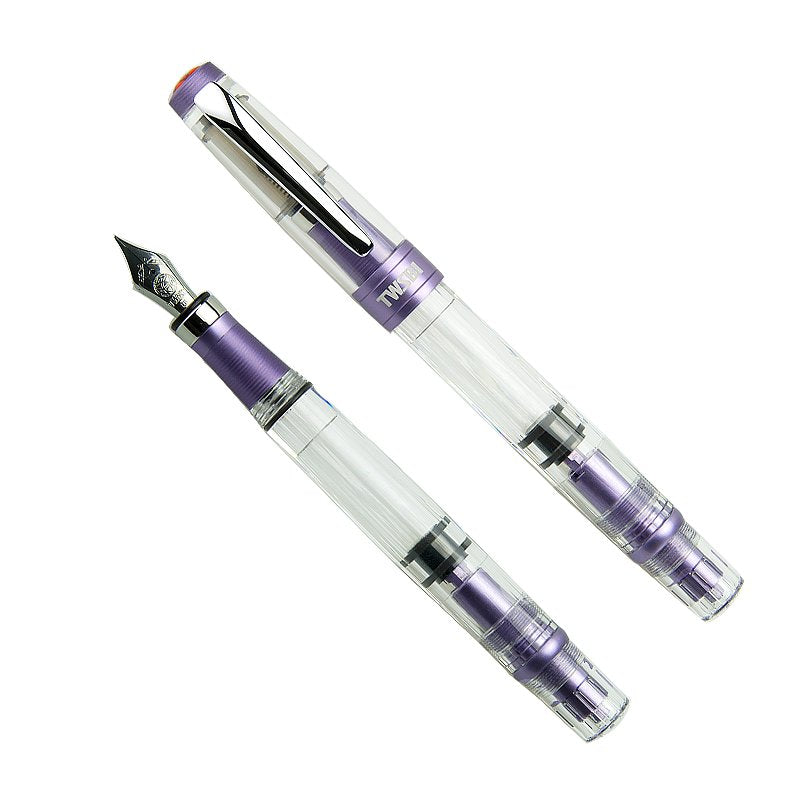 Diamond 580 ALR (Purple) - Medium fountain pen with clear barrel, lavender-purple trim, piston-filling mechanism; shown capped and uncapped displaying the medium-sized nib.