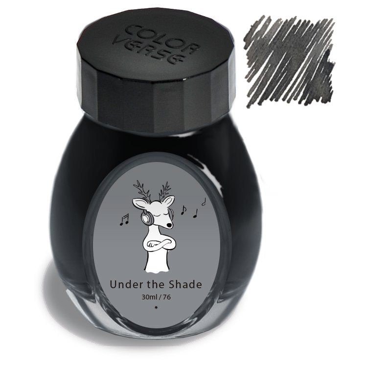 Under the Shade - 30ml glass bottle of Colorverse ink, featuring a deer with headphones on the label, showcasing dark gray-black ink swab.