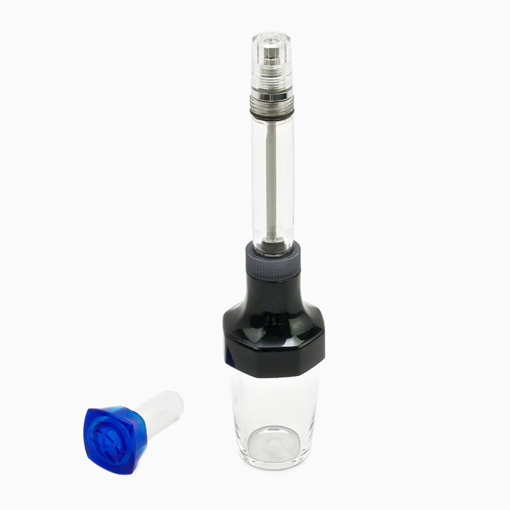 VAC20A Ink Bottle - Green, a compact, clear plastic bottle with a green cap, designed for refilling TWSBI pens, includes multiple caps for different pen models.