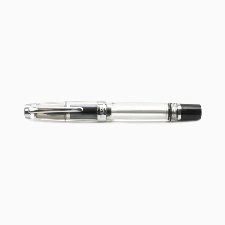 VAC Mini (Smoke) - Medium fountain pen with transparent barrel showing piston mechanism, silver clip, black end cap, ideal for travel with vacuum filling system.
