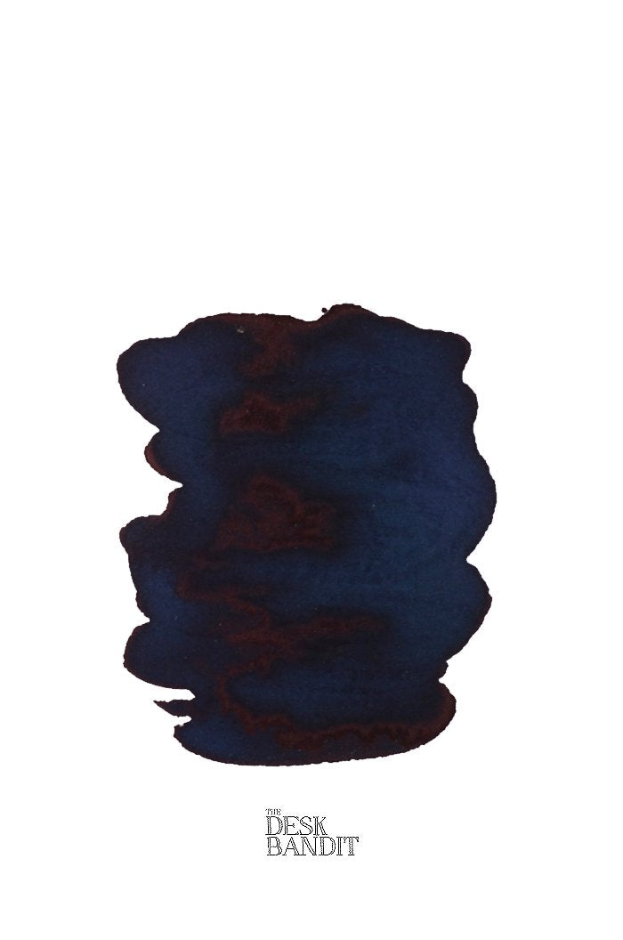 Verdigris (2ml) ink sample shows a dark navy blue swatch with reddish sheen, featuring THE DESK BANDIT logo, highlighting its rich, dye-based formula.