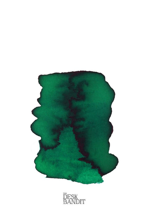 Swatch of Verdura (2ml) green ink by Rohrer & Klingner, showcasing varying saturation on white paper, with THE DESK BANDIT logo visible.