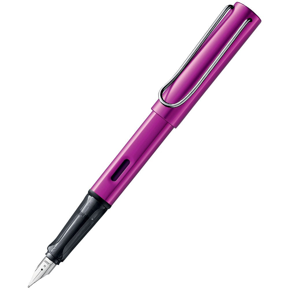 LAMY AL-Star (Vibrant Pink) fountain pen with anodised aluminium finish, translucent black grip, and medium stainless-steel nib, featuring a metal clip on the cap.
