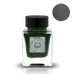 Small square glass bottle of Wabi 侘 - 2ml ink sample by Tono & Lims, featuring a black cap and decorative label, showcasing the ink's deep forest-green shade.