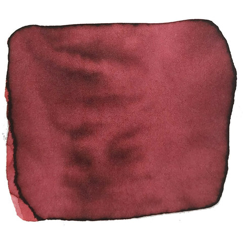 Swatch of Robert Oster's Whisper Red ink, 2ml sample, displaying varied tone intensity on a white background, highlighting its dye-based pigment characteristics.