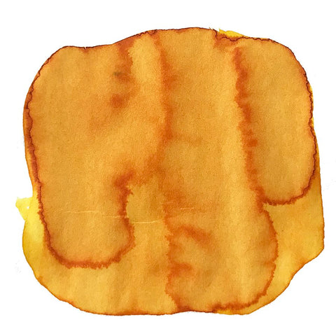 Yellow Sunset - 2ml ink sample showing a yellow-orange abstract blot on white, resembling a watercolor stain, highlighting its vibrant, free-form dye-based nature.